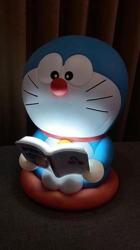 Hình Doremon chibi ngủ gật trên chiếc gối êm ái